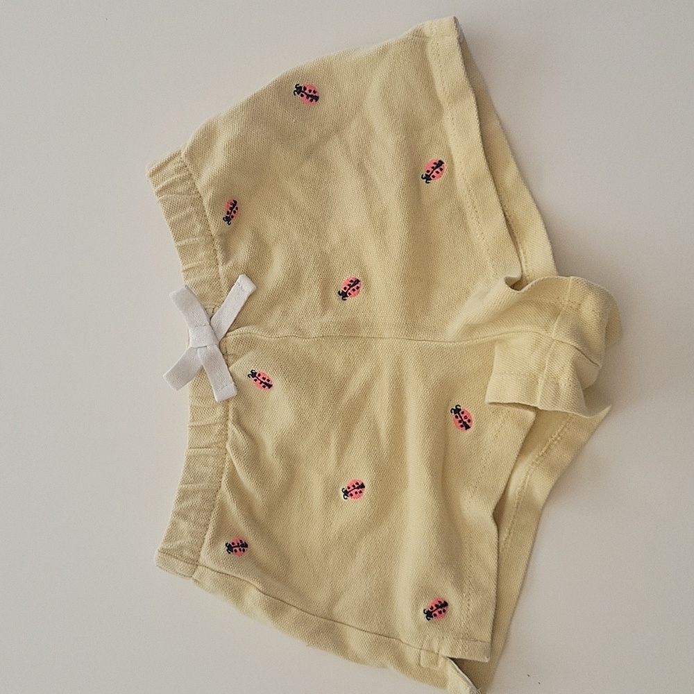 Ralph Lauren kids shorts in pastel yellow and embroidered ladybug pattern